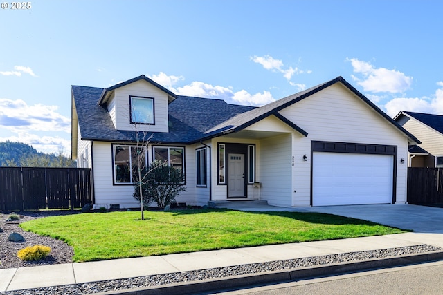 view of front of property with fence, a front yard, a garage, crawl space, and driveway