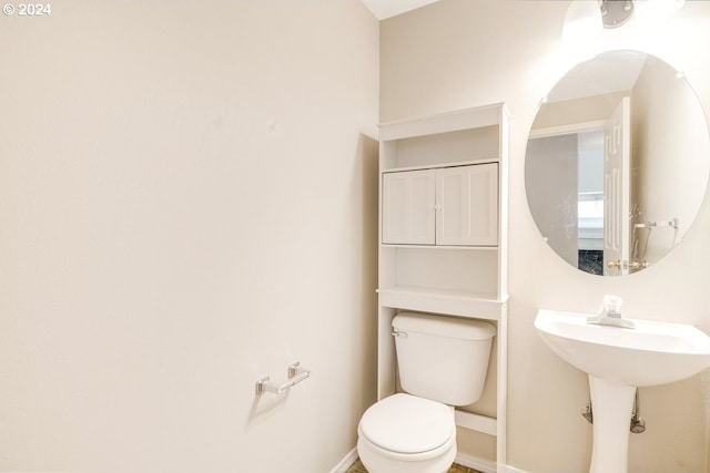 bathroom with toilet and sink