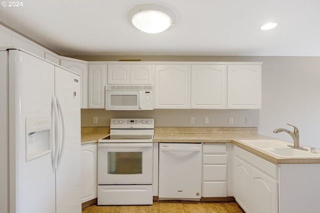 kitchen featuring white cabinetry, sink, and white appliances