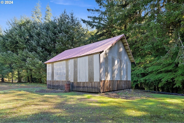 view of outdoor structure featuring a lawn