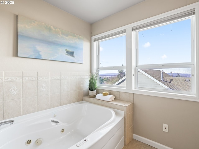 bathroom featuring a washtub and tile patterned flooring