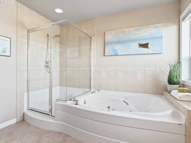 bathroom featuring independent shower and bath and tile patterned flooring