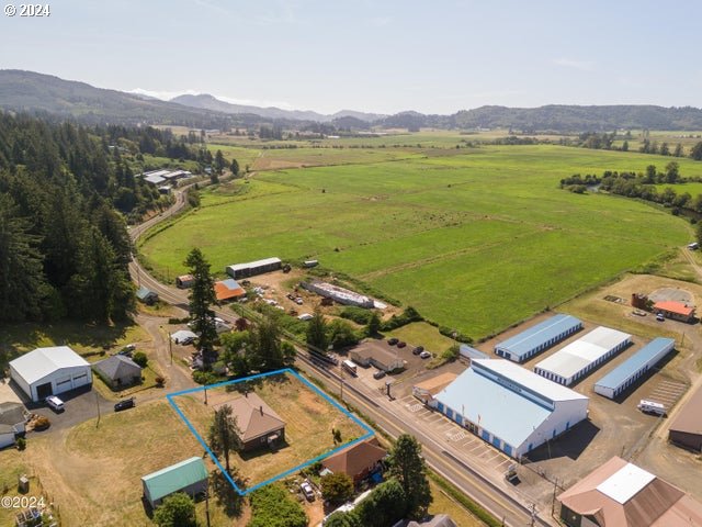 drone / aerial view featuring a rural view and a mountain view