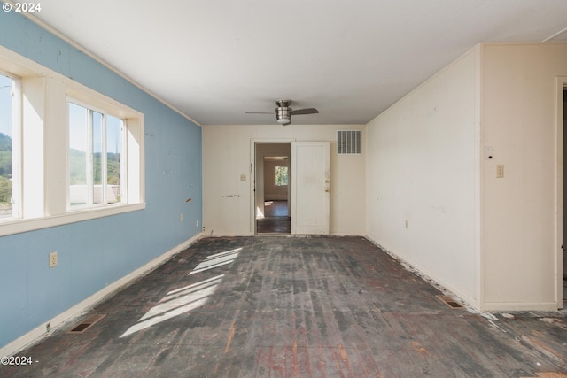 interior space with dark hardwood / wood-style flooring and ceiling fan