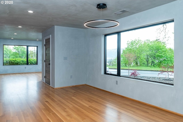 unfurnished room featuring light hardwood / wood-style flooring