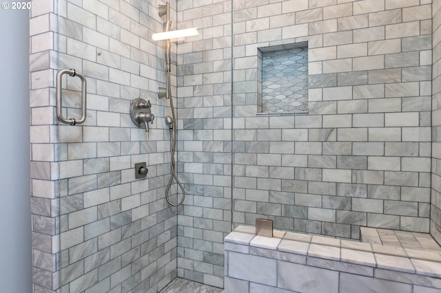 bathroom featuring tiled shower