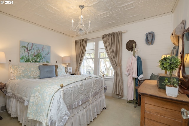 bedroom with a notable chandelier and carpet