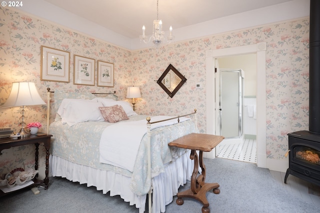 carpeted bedroom featuring a wood stove and an inviting chandelier