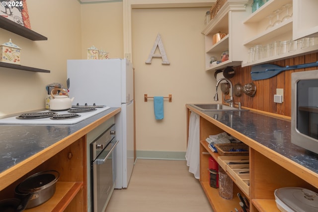 847 Exchange St Unit 0 817-, Astoria, OR 97103 - kitchen featuring a sink, stainless steel microwave, open shelves, light tile patterned flooring, and baseboards