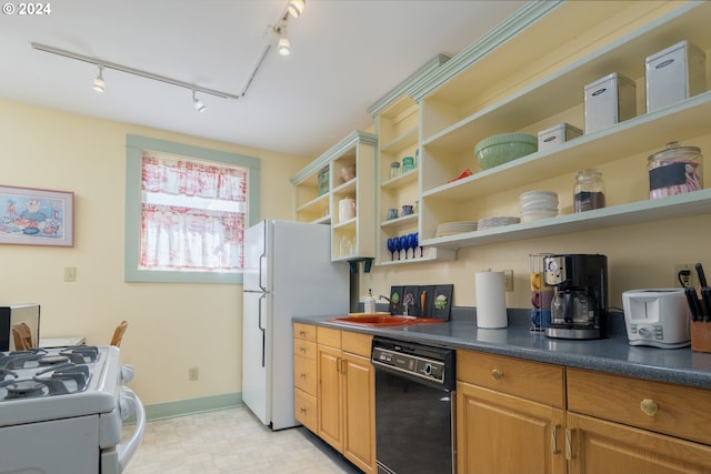 kitchen featuring rail lighting and white appliances