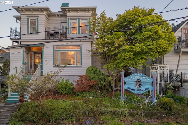 italianate home with a balcony