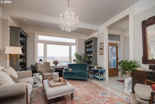 living room featuring hardwood / wood-style floors and a notable chandelier