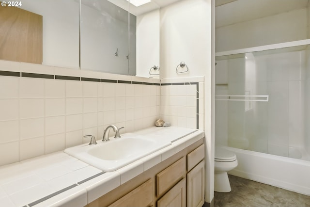 full bathroom with tasteful backsplash, vanity, shower / washtub combination, tile walls, and toilet