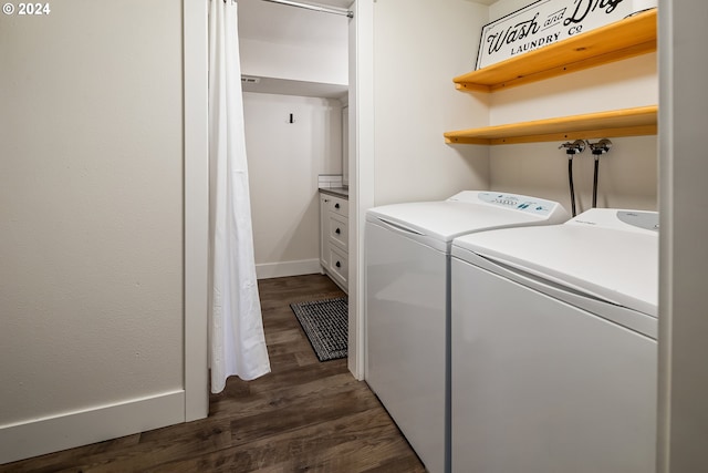 clothes washing area with washer and clothes dryer and dark hardwood / wood-style floors