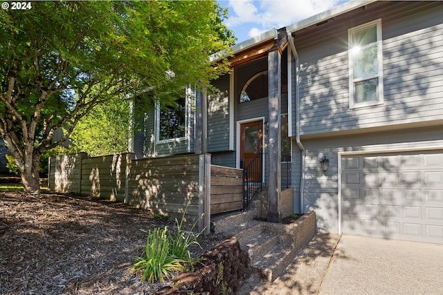 entrance to property featuring a garage