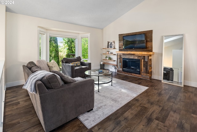 living room featuring a stone fireplace, dark wood-type flooring, and vaulted ceiling