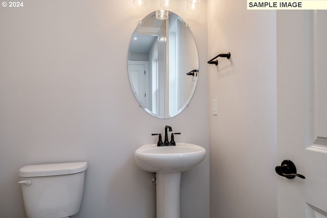 bathroom with sink and toilet