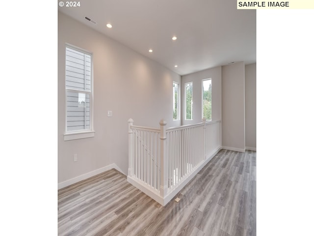 spare room featuring light hardwood / wood-style flooring