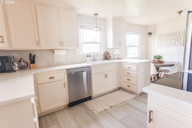 1485 Polk St, Eugene, OR 97402 - kitchen featuring dishwasher, tasteful backsplash, a peninsula, and pendant lighting