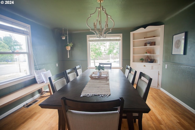 1485 Polk St, Eugene, OR 97402 - dining space with wood finished floors and a chandelier