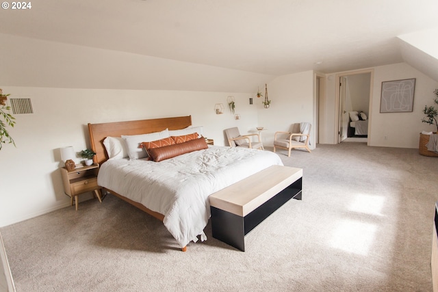 bedroom featuring vaulted ceiling and carpet flooring