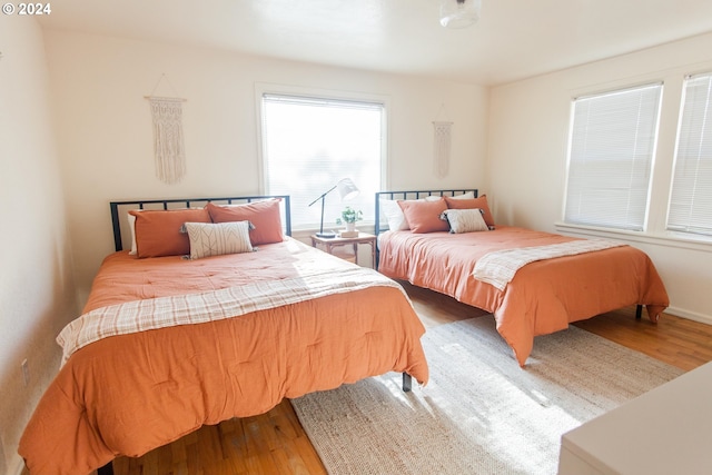 bedroom featuring wood finished floors