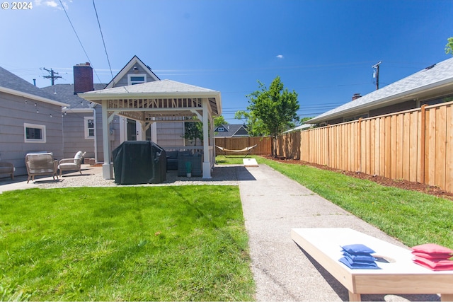 view of yard with a gazebo, a patio, and a fenced backyard