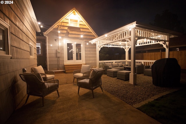 1485 Polk St, Eugene, OR 97402 - patio at night with outdoor lounge area, french doors, and a patio area