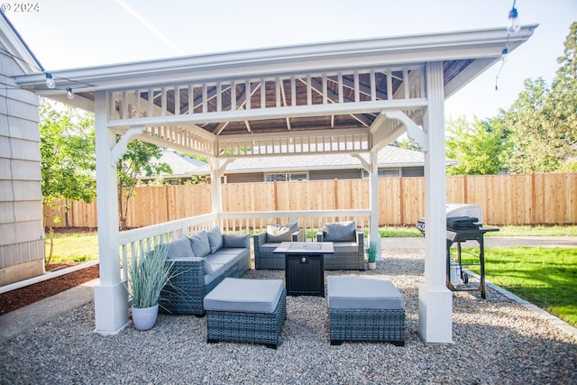 view of patio with grilling area, a fenced backyard, outdoor lounge area, and a gazebo