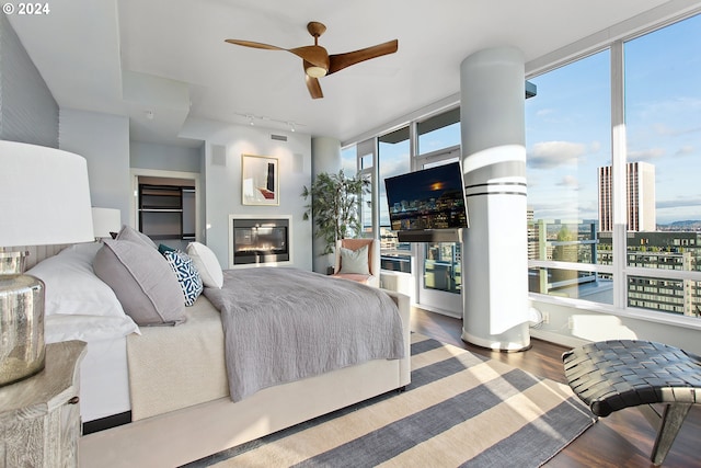 bedroom with ceiling fan and wood-type flooring