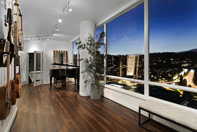 sunroom featuring track lighting