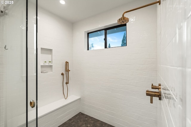 bathroom featuring tiled shower