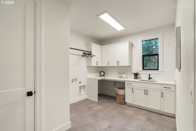 laundry room with hookup for a washing machine, sink, cabinets, and hookup for an electric dryer