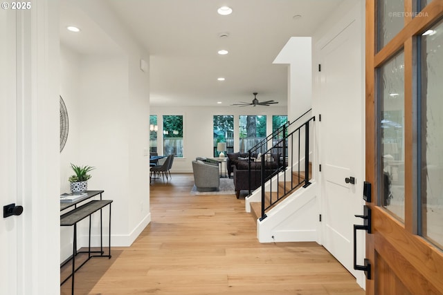 entryway featuring ceiling fan and light hardwood / wood-style floors