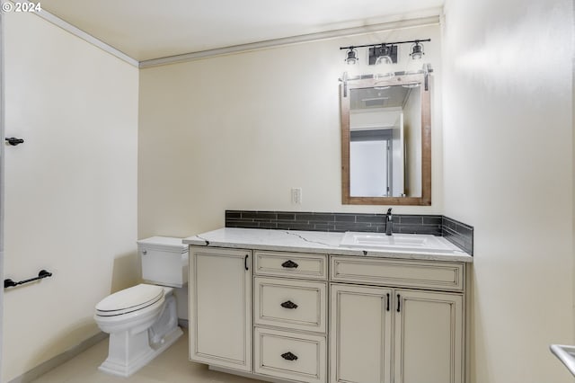 bathroom with tile patterned flooring, toilet, and vanity