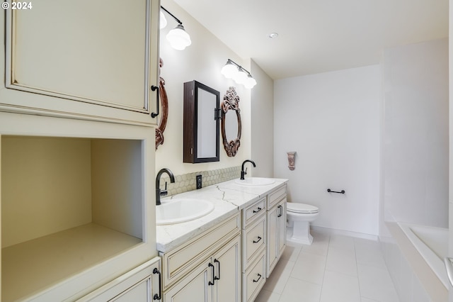 bathroom with vanity, tiled tub, tile patterned floors, and toilet