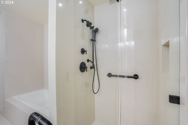 bathroom with tiled shower