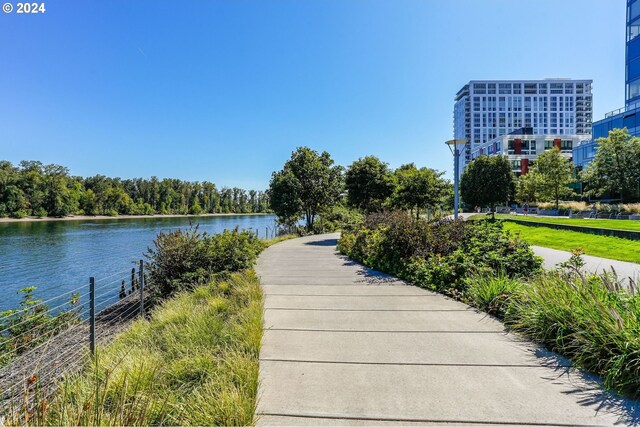 surrounding community with a water view