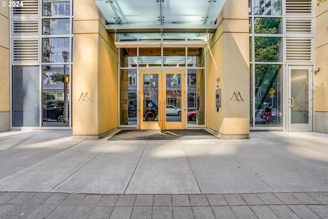 doorway to property featuring stucco siding