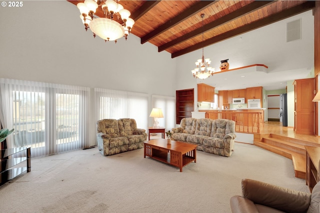 living area featuring a chandelier, wooden ceiling, visible vents, and light colored carpet