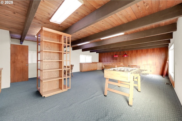 recreation room featuring wooden ceiling, carpet flooring, beamed ceiling, and wood walls