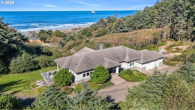 birds eye view of property with a view of the beach and a water view