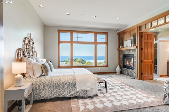 carpeted bedroom featuring a water view