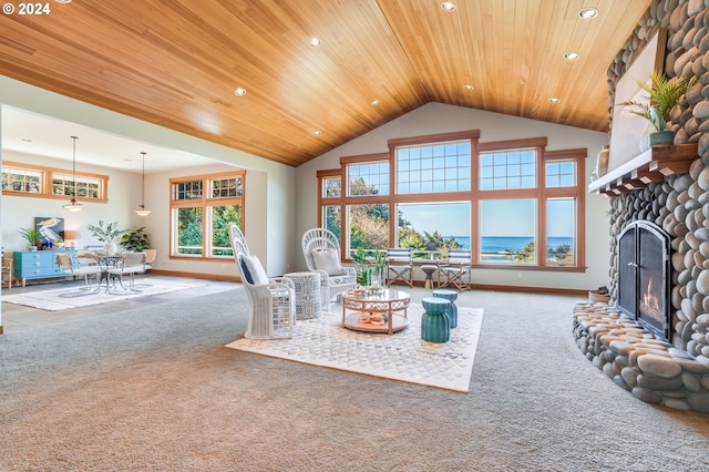 carpeted living room with wood ceiling, a water view, high vaulted ceiling, and a fireplace