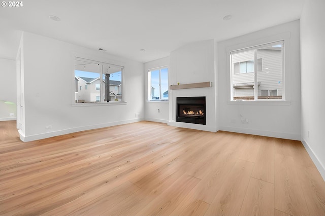 unfurnished living room featuring light hardwood / wood-style floors