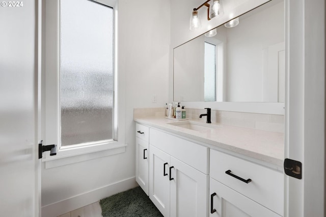 bathroom featuring plenty of natural light and vanity