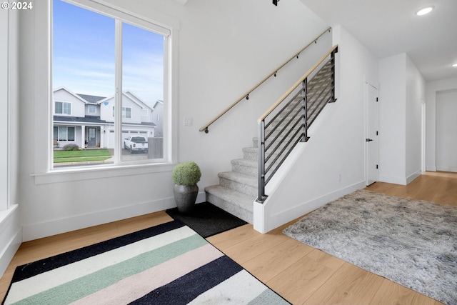 entryway featuring a healthy amount of sunlight and hardwood / wood-style flooring