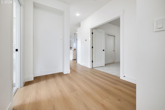 hallway featuring light hardwood / wood-style flooring