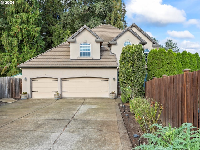 front of property with a garage