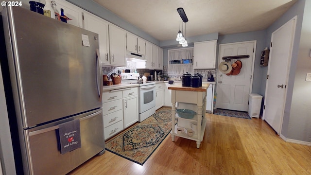 kitchen with freestanding refrigerator, white range with electric stovetop, light wood-type flooring, under cabinet range hood, and white cabinets
